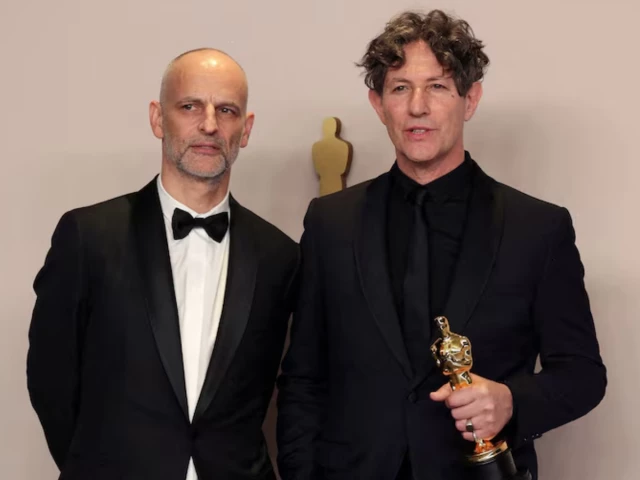 director jonathan glazer poses alongside producer james wilson with the oscar photo reuters